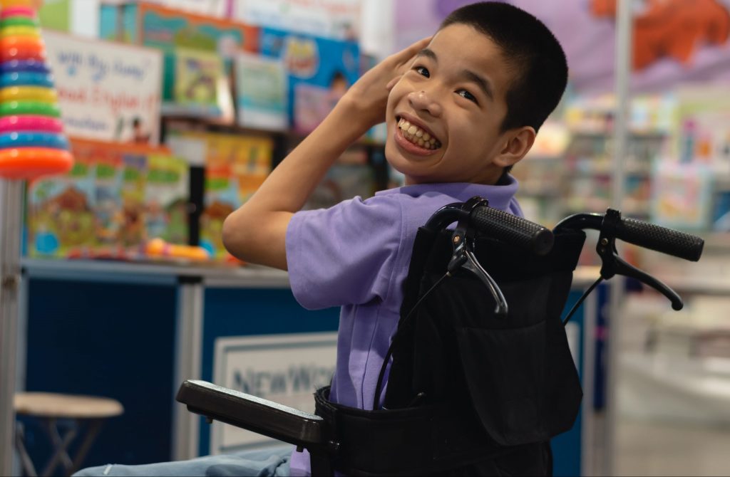 Child with special needs on wheelchair.
