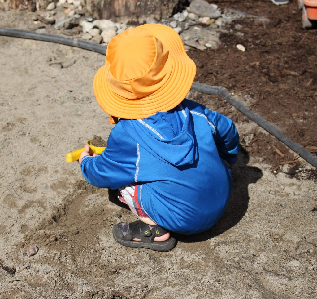 Child playing in dirt.